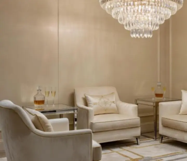 Bohemian crystal chandeliers casting warm light across the Czechroom lounge.
